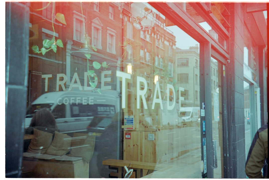 services-03 reflection-of-a-street-scene-in-a-coffee-shop-window-nbrcuot8nrk